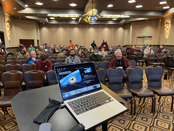 A MacBook Air set up on a podium at CodeMash 10000.